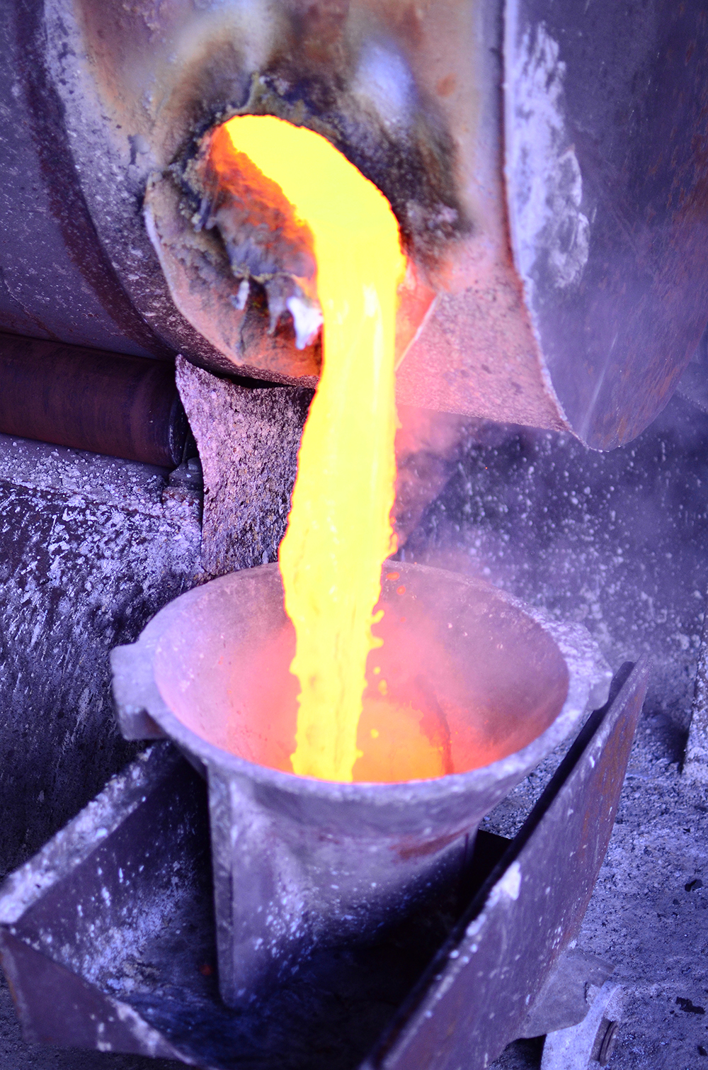 Molten Metal Pouring From Furnace